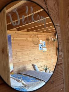 a mirror reflection of a bed in a room at B&B Bed in Burgh in Burgh Haamstede