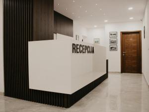 a reception area in a building with a reception desk at Hotel Villa Matić in Neum