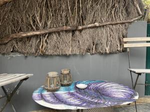 a table with two candles on top of it at Janela para o Atlântico in Porto Moniz