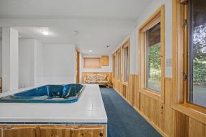 a bathroom with a blue sink in a room at Crystal Creek Chalet - Meredith Lodging in Welches