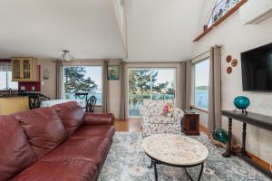 a living room with a couch and a table at Waldport Beach Haven in Waldport