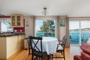a kitchen and dining room with a table and chairs at Waldport Beach Haven in Waldport