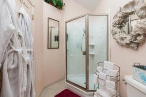 a bathroom with a shower with a glass shower stall at Waldport Beach Haven in Waldport +37 photos