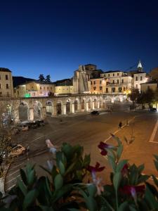 a view of a city at night at Piazza Maggiore in Sulmona