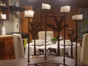 a dining room table with a table cloth with elephants on it at Rincon Acogedor in Bogotá