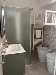a bathroom with a shower and a sink and a tub at Piazza Maggiore in Sulmona +23 photos