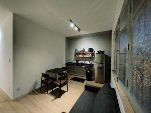 a living room with a couch and a table at Ap Umarizal l WiFi 500MB in Belém