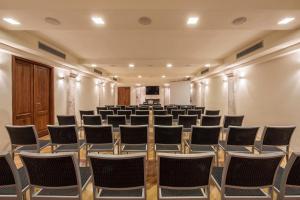 a large room with rows of chairs in it at San Biagio Relais in Orbetello