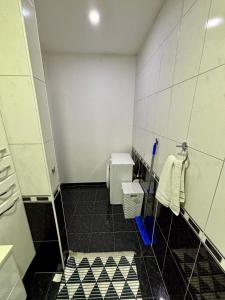 a bathroom with a shower and a toilet in it at The Olive Tree Apartment in Ljubuški