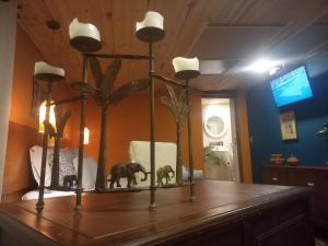 a mirror with two elephants on top of a table at Rincon Acogedor in Bogotá
