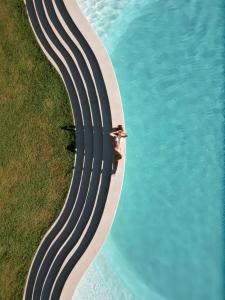 an aerial view of a road next to the water at Mayto Astrological Park in Maito +10 photos