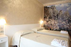 Letto o letti in una camera di I Rocchi Hotel