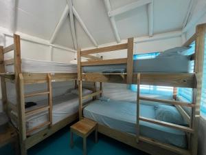 a couple of bunk beds in a room at Hostel La Bohème in Las Terrenas +71 photos