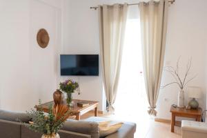 a living room with a couch and a table at Casa Dimilia in Sívros