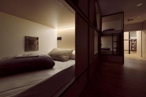 a bedroom with a bed and a large mirror at Albergue San Nicolás in Logroño +25 photos