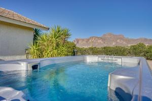 a swimming pool with a view of the mountains at Private Hot Tub & Epic Views in Superstition Mtns! in Apache Junction