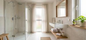 a bathroom with a sink and a shower at pınar apart hotel in Kapuluören
