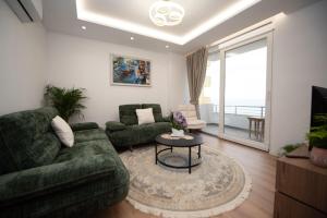a living room with a couch and a table at Asinara Guatanamo Belmarsh in Durrës