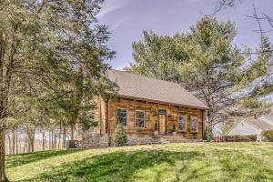 a log home with a large yard at Luxury Lakefront Cabin in Castalian Springs