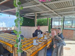 a group of people sitting at a table at HOTEL CHOQOLAqA RESTAURANT in Cabanaconde