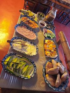 a table topped with lots of different types of food at HOTEL CHOQOLAqA RESTAURANT in Cabanaconde