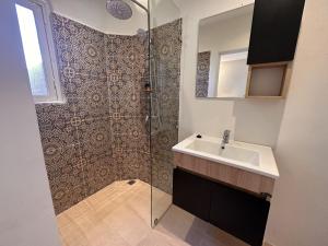 a bathroom with a shower and a sink at Casa Bianca in Marrakesh +44 photos