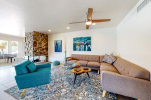 a living room with a couch and two chairs and a table at Desert Retreat in Indian Wells