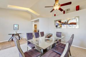 a dining room with a glass table and chairs at Evening Star in Indian Wells