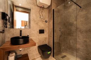 a bathroom with a sink and a shower at Résidence Luxoria - Gauthier in Casablanca +37 photos