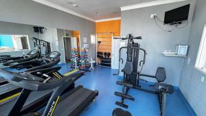 a gym with a bunch of exercise bikes in a room at Hotel em Perdizes - FLAT1402 - By TorresGuest in São Paulo
