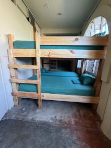 a couple of bunk beds in a room at TerraZica hostal in Brisas de Zicatela