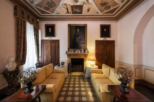 a living room filled with furniture and a fireplace at San Biagio Relais in Orbetello