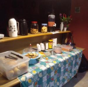 a table with a table cloth with food on it at Hotel Pousada na Br 040 in Valparaíso de Goiás