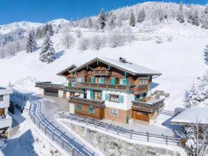 a chalet in the mountains with snow at Andre Top 2 in Wald im Pinzgau