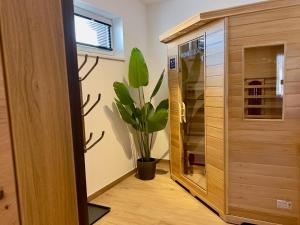 a potted plant in a room next to a closet at Gipfelglück in Sankt Lambrecht +80 photos