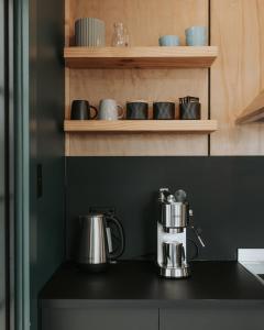 a coffee maker on a counter in a kitchen at The Rectory Zeehan in Zeehan