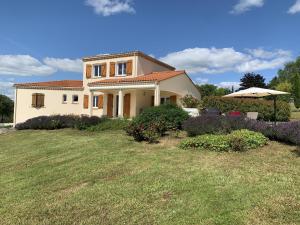 a house with a large yard in front of it at Les Graves in Saint-Pierre-Lafeuille