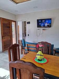 a room with a table with a hat on it at Cabaña los amarillos in Huacalera