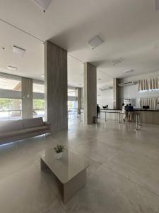 a lobby with a bench and a table in a building at Spazzio diRoma com acesso ao Acqua Park in Caldas Novas +55 photos