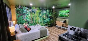 a bedroom with a large painting on the wall at Zen Retreat-Jacuzzi, kitchenette, Walk to fun in Reno