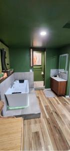 a large bathroom with a large tub and two sinks at Zen Retreat-Jacuzzi, kitchenette, Walk to fun in Reno +20 photos