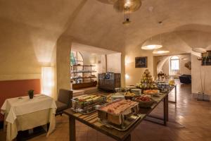 a kitchen with a table with food on it at San Biagio Relais in Orbetello