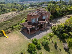 an aerial view of a house on a hill at Rocks Glamping - Guatapé, El Peñol in El Peñol
