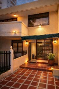 a house with an awning in front of it at Hotel ladymar cartagena in Cartagena de Indias