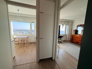 a room with a table and a dining room at The Treetop Apartment in Turku