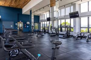a gym with treadmills and cardio equipment in a building at ON Smart Lofts - 3 min a pé da Oktoberfest com cama Queen in Blumenau +46 photos
