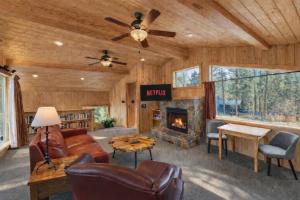 a living room with a couch and a fireplace at Riverside Loft Suite home in Leavenworth