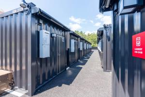 a row of bins sitting next to each other at HOTEL R9 Kujukuri "ex Casual Resort COFF Ichinomiya" in Ichinomiya
