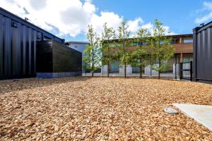 a large pile of leaves in front of a building at HOTEL R9 Kujukuri "ex Casual Resort COFF Ichinomiya" in Ichinomiya