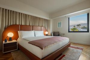 a bedroom with a large bed and a window at SIXTY Beverly Hills in Los Angeles